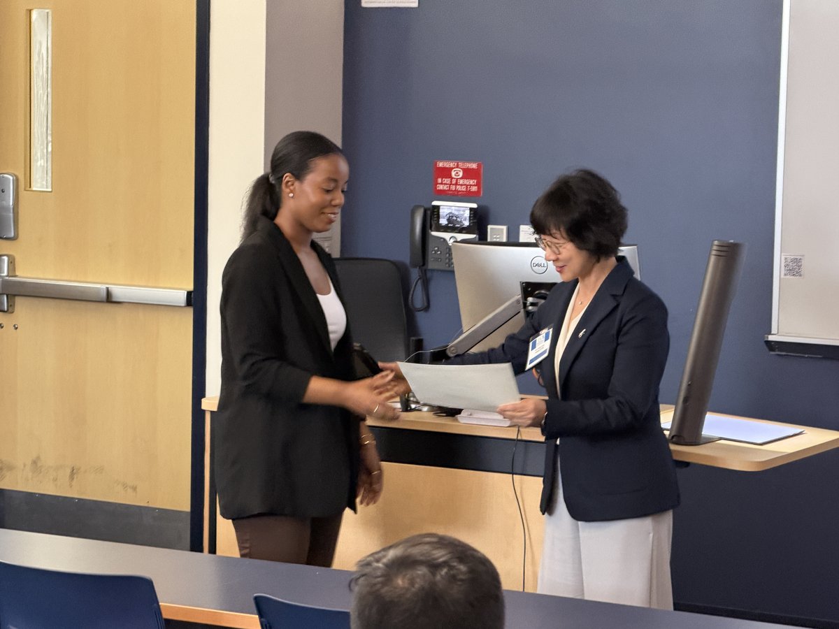 Jade Muyambo receiving award