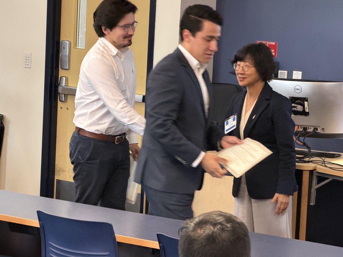 Daniel and Miguel receiving award