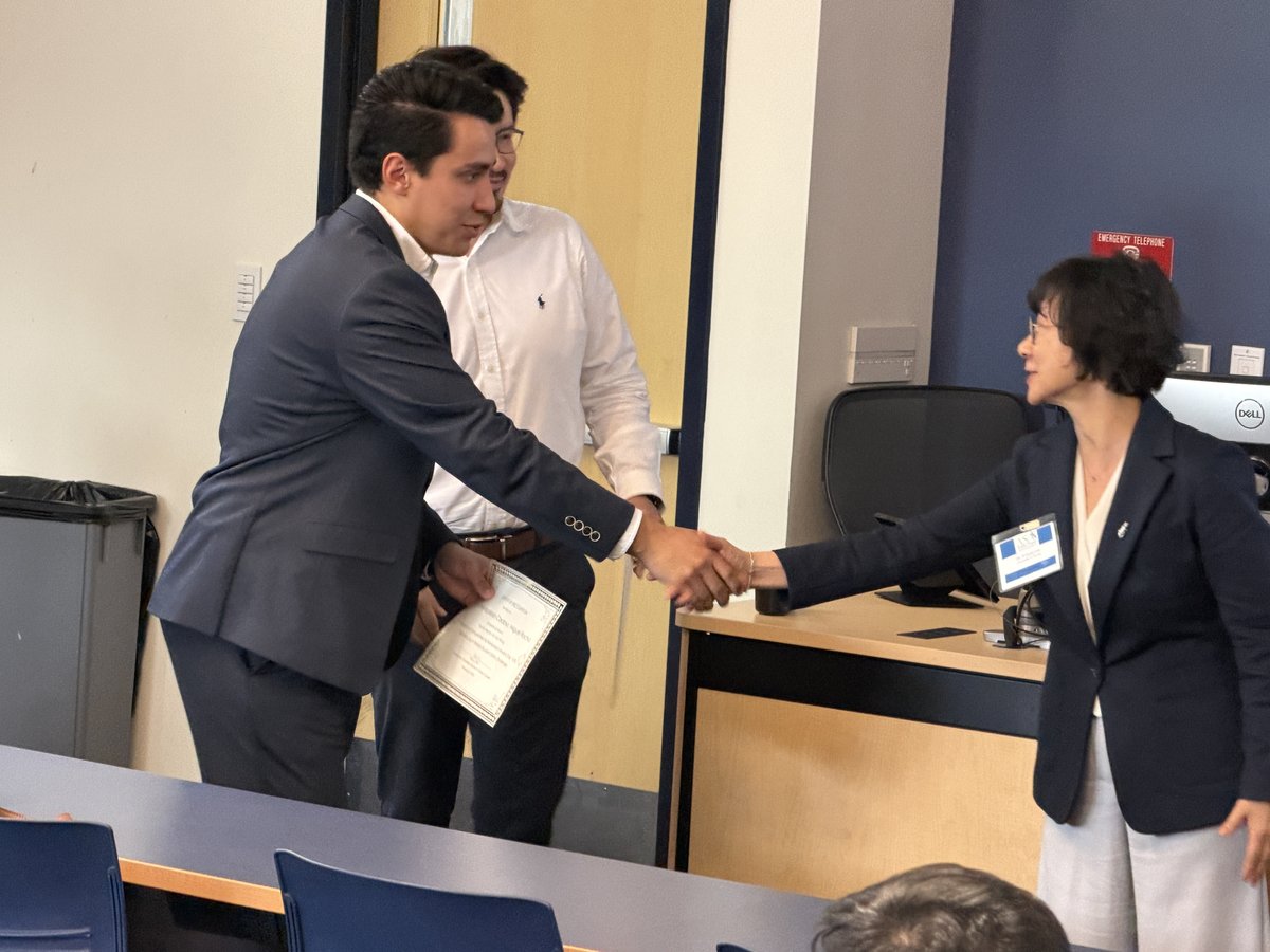 Daniel and Miguel receiving award